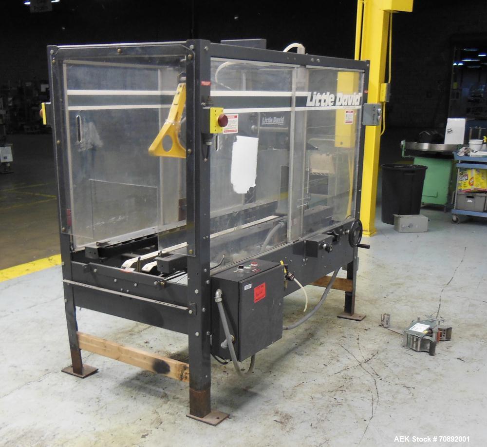 Used Loveshaw Little David Model LD16A Top and Bottom Automatic Case Sealer. Missing (1) tape head. Capable of speeds up to 60 feet per minute or 14 cases per minute. Case size range: (length) 8-1/2"...
