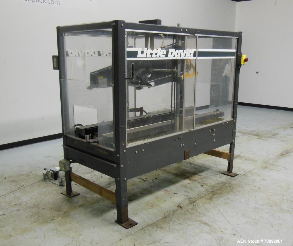 Used Loveshaw Little David Model LD16A Top and Bottom Automatic Case Sealer. Missing (1) tape head. Capable of speeds up to 60 feet per minute or 14 cases per minute. Case size range: (length) 8-1/2"...