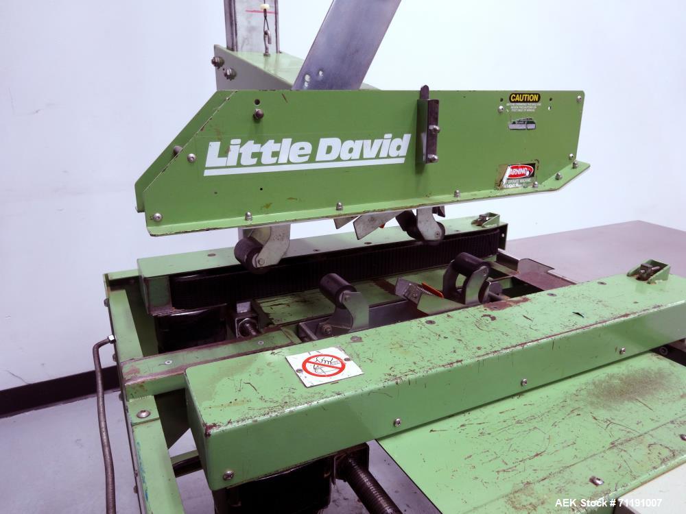 Used Loveshaw Little David Model LD3SB Top & Bottom Tape Case Sealer. Capable of speeds up to 60 feet per minute. Box capacity- Length: 3" to unlimited, Width: 4-1/2" to 20", Height: 4-1/2" to 20". U...