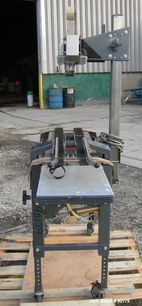 USED: Loveshaw Corp semi-automatic uniform top and bottom case taper, model LD-4C, carbon steel. Case sealer capacity: minimum 2" high x 4-1/2" wide x 4-1/2" long, maximum 26" high x 20" wide x infin...