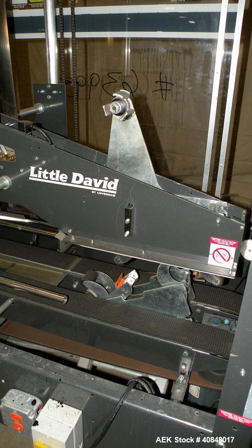 Used Loveshaw Little David Model LD16A Top and Bottom Automatic Case Sealer. Caspable of speeds up to 60 feet per minute or 14 cases per minute. Case size range: (length) 8-1/2" to 24" (width) 4-1/2"...