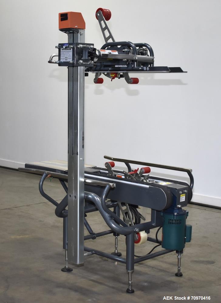 Used Loveshaw / Little David Model LDX/CRS Case Taper. Box Capacity: 4.5" to unlimited length x 5.5" to 27" width x 4.5" to 24" height. Operating belt speeds: 80 ft/min. Maximum roll diameter 15". Se...