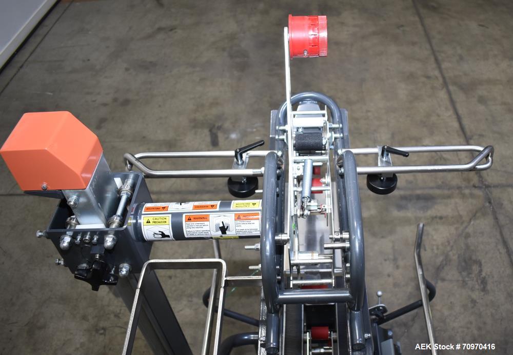 Used Loveshaw / Little David Model LDX/CRS Case Taper. Box Capacity: 4.5" to unlimited length x 5.5" to 27" width x 4.5" to 24" height. Operating belt speeds: 80 ft/min. Maximum roll diameter 15". Se...