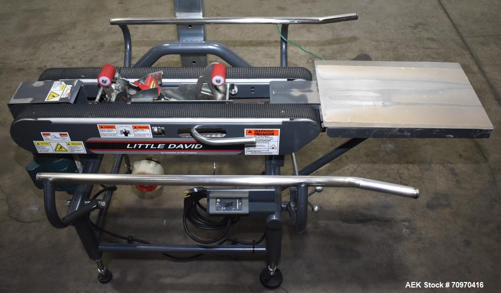 Used Loveshaw / Little David Model LDX/CRS Case Taper. Box Capacity: 4.5" to unlimited length x 5.5" to 27" width x 4.5" to 24" height. Operating belt speeds: 80 ft/min. Maximum roll diameter 15". Se...