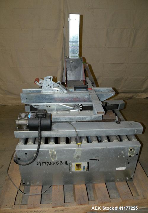Used Soco Systems Top and Bottom Case Taper, Model T-10. Capable of speeds up to 30 cases per minute. Semi automatic operation, with side belts to pull case through tape heads. Case size range: lengt...