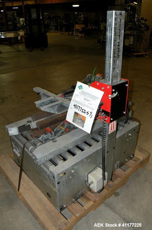 Used Soco Systems Top and Bottom Case Taper, Model T-10. Capable of speeds up to 30 cases per minute. Semi automatic operation, with side belts to pull case through tape heads. Case size range: lengt...