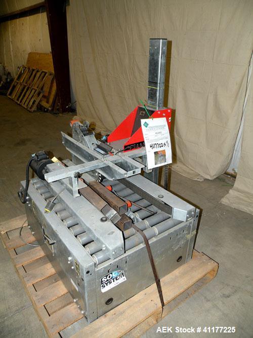 Used Soco Systems Top and Bottom Case Taper, Model T-10. Capable of speeds up to 30 cases per minute. Semi automatic operation, with side belts to pull case through tape heads. Case size range: lengt...