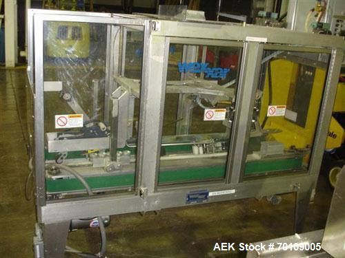 Used Wexxar WST-77 Automatic Top and Bottom Case Sealer. Capable of speeds up to 35 cases per minute. Case size range: length 12" to 33", width 10" to 22.5", depth 10" to 24". 3/60/230V.