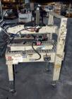Used 3M 12A-18600 Semi-Auto Adjustable Top Case Taper capable of speeds up to 27 cpm depending on application and operator dexterity. Case size range of:  6