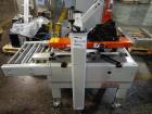 Used 3M Model 200A, Type 19000 Top and Bottom Adjustable Case Sealer. Up to 40 cases per minute, minimum case size 6