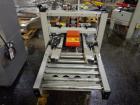 Used- 3M Model 200A, Type 19000 Top and Bottom Adjustable Case Sealer. Up to 40 cases per minute, minimum case size 6