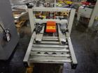 Used 3M Model 200A, Type 19000 Top and Bottom Adjustable Case Sealer. Up to 40 cases per minute, minimum case size 6