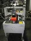 Used 3M Model 200A, Type 29200 Top and Bottom Adjustable Case Sealer. Up to 40 cases per minute, minimum case size 6