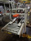 Used 3M Model 200A, Type 19000 Case Sealer. Top and bottom heads. Capable of speeds up to to 40 cases per minute, minimum case size 6
