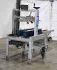 Used Belcor 150 Top and Bottom Case Tape Sealer, Model BEL 150SF. Rated up to 30 cases per minute. Case size range: 8