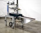 Used- Belcor 150 Top and Bottom Case Tape Sealer, Model BEL 150SF. Rated up to 30 cases per minute. Case size range: 8