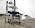 Used Belcor 150 Top and Bottom Case Tape Sealer, Model BEL 150SF. Rated up to 30 cases per minute. Case size range: 8