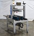 Used Belcor 150 Top and Bottom Case Tape Sealer, Model BEL 150SF. Rated up to 30 cases per minute. Case size range: 8