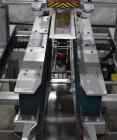 Used Belcor 150 Top and Bottom Case Tape Sealer, Model BEL 150SF. Rated up to 30 cases per minute. Case size range: 8