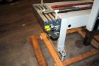 Used Belcor (Wexxar) Model 185 automatic random top case taper sealer. Capable of speeds up to 20 cases per minute. Has a case size range: 8