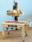 Used Belcor (Wexxar) Model 185 automatic random top case taper sealer. Capable of speeds up to 20 cases per minute. Has a case size range: 8