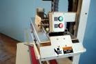 Used Belcor (Wexxar) Model 185 automatic random top case taper sealer. Capable of speeds up to 20 cases per minute. Has a case size range: 8
