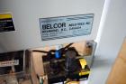 Used Belcor (Wexxar) Model 185 automatic random top case taper sealer. Capable of speeds up to 20 cases per minute. Has a case size range: 8