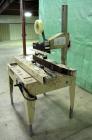 Used Bemis Semi-Automatic Uniform Top /Bottom Case Taper, Model 1018SA, carbon steel. Capable of speeds up to 28 CPM. Has side belt transfers and a case size range: length 4-1/2