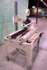 Used Bemis Semi-Automatic Uniform Top /Bottom Case Taper, Model 1018SA, carbon steel. Capable of speeds up to 28 CPM. Has side belt transfers and a case size range: length 4-1/2