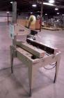 Used Bemis Semi-Automatic Uniform Top /Bottom Case Taper, Model 1018SA, carbon steel. Capable of speeds up to 28 CPM. Has side belt transfers and a case size range: length 4-1/2