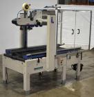 Used Interpack UA 262024-SB Uniform Automatic Case Sealer. Capable of up to 12 cases per minute. Size range of 6 to 26