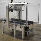 Used- Interpack UA 262024-SB Uniform Automatic Case Sealer. Capable of up to 12 cases per minute. Size range of 6 to 26