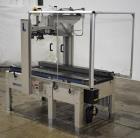 Used Interpack UA 262024-SB Uniform Automatic Case Sealer. Capable of up to 12 cases per minute. Size range of 6 to 26