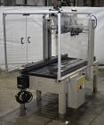 Used Interpack UA 262024-SB Uniform Automatic Case Sealer. Capable of up to 12 cases per minute. Size range of 6 to 26