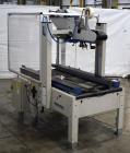 Used Interpack UA 262024-SB Uniform Automatic Case Sealer. Capable of up to 12 cases per minute. Size range of 6 to 26