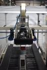 Used Interpack UA 262024-SB Uniform Automatic Case Sealer. Capable of up to 12 cases per minute. Size range of 6 to 26