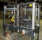 Used Loveshaw Little DavidTop And Bottom Automatic Case Sealer, Model LD16A. Capable of speeds up to 60 feet per minute or 14 cases per minute. Case size range: (length) 8-1/2