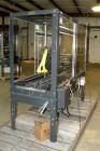 Used Loveshaw Little DavidTop And Bottom Automatic Case Sealer, Model LD16A. Capable of speeds up to 60 feet per minute or 14 cases per minute. Case size range: (length) 8-1/2