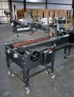 Used Little David SP304 top and bottom case sealer. Operating speed up to 72' per minute. Side belt drives with a case size range: (Length)6