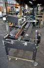 Used Little David SP304 top and bottom case sealer. Operating speed up to 72' per minute. Side belt drives with a case size range: (Length)6