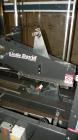 Used Loveshaw Little David Model LD16A Top and Bottom Automatic Case Sealer. Caspable of speeds up to 60 feet per minute or 14 cases per minute. Case size range: (length) 8-1/2