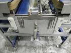 Used Durable Packaging Model RM-32FCAS Case Sealer. Machine is capable of speeds up to 40 cases per minute.Case size range: unlimited (length), 5