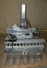 Used Soco Systems Top and Bottom Case Taper, Model T-10. Capable of speeds up to 30 cases per minute. Semi automatic operation, with side belts to pull case through tape heads. Case size range: lengt...