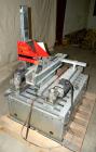 Used Soco Systems Top and Bottom Case Taper, Model T-10. Capable of speeds up to 30 cases per minute. Semi automatic operation, with side belts to pull case through tape heads. Case size range: lengt...