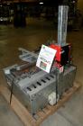 Used Soco Systems Top and Bottom Case Taper, Model T-10. Capable of speeds up to 30 cases per minute. Semi automatic operation, with side belts to pull case through tape heads. Case size range: lengt...