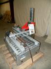Used Soco Systems Top and Bottom Case Taper, Model T-10. Capable of speeds up to 30 cases per minute. Semi automatic operation, with side belts to pull case through tape heads. Case size range: lengt...
