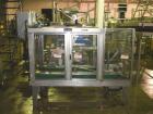 Used Wexxar WST-77 Automatic Top and Bottom Case Sealer. Capable of speeds up to 35 cases per minute. Case size range: length 12