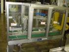 Used Wexxar WST-77 Automatic Top and Bottom Case Sealer. Capable of speeds up to 35 cases per minute. Case size range: length 12