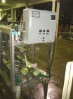 Used Wexxar WST-77 Automatic Top and Bottom Case Sealer. Capable of speeds up to 35 cases per minute. Case size range: length 12