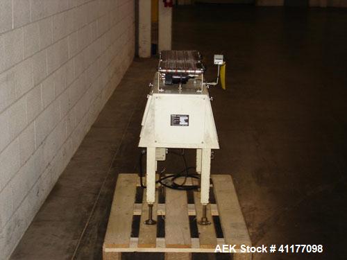 Used Yamato CA15L-00 Checkweigher. Weight range from 10g to 1500g with accuracy of +/- 1 gram. Last weighing cartons of ice cream cones. Dimensions: 31" L x R, 18" wide x 37" high. Belt width is 9".